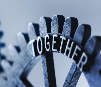 Interlocking gears spelling the word together