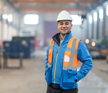 man standing with orange vest